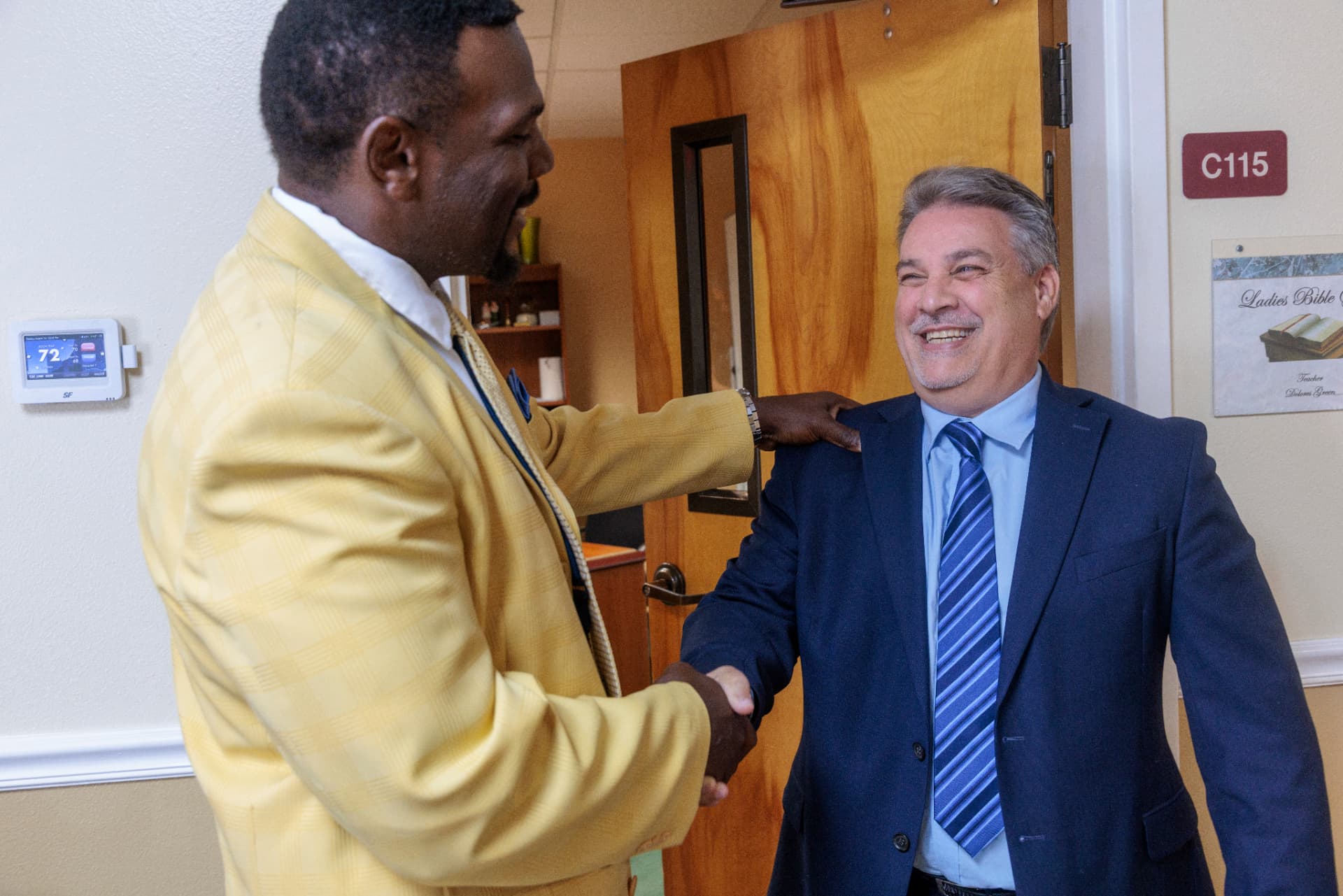 Robert Prater greeting a church and community leader
