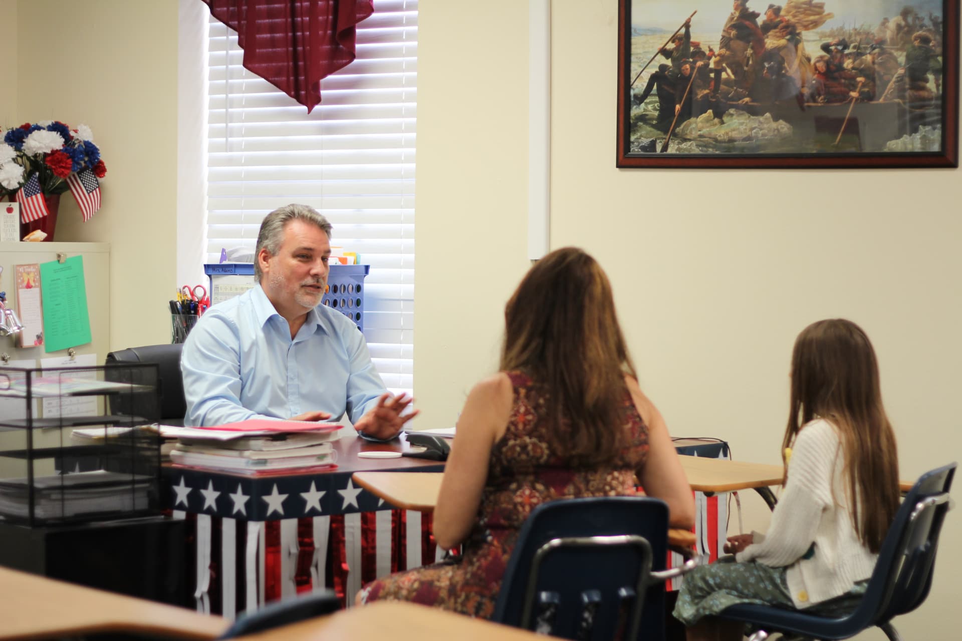 Robert Prater meeting with a mother and student